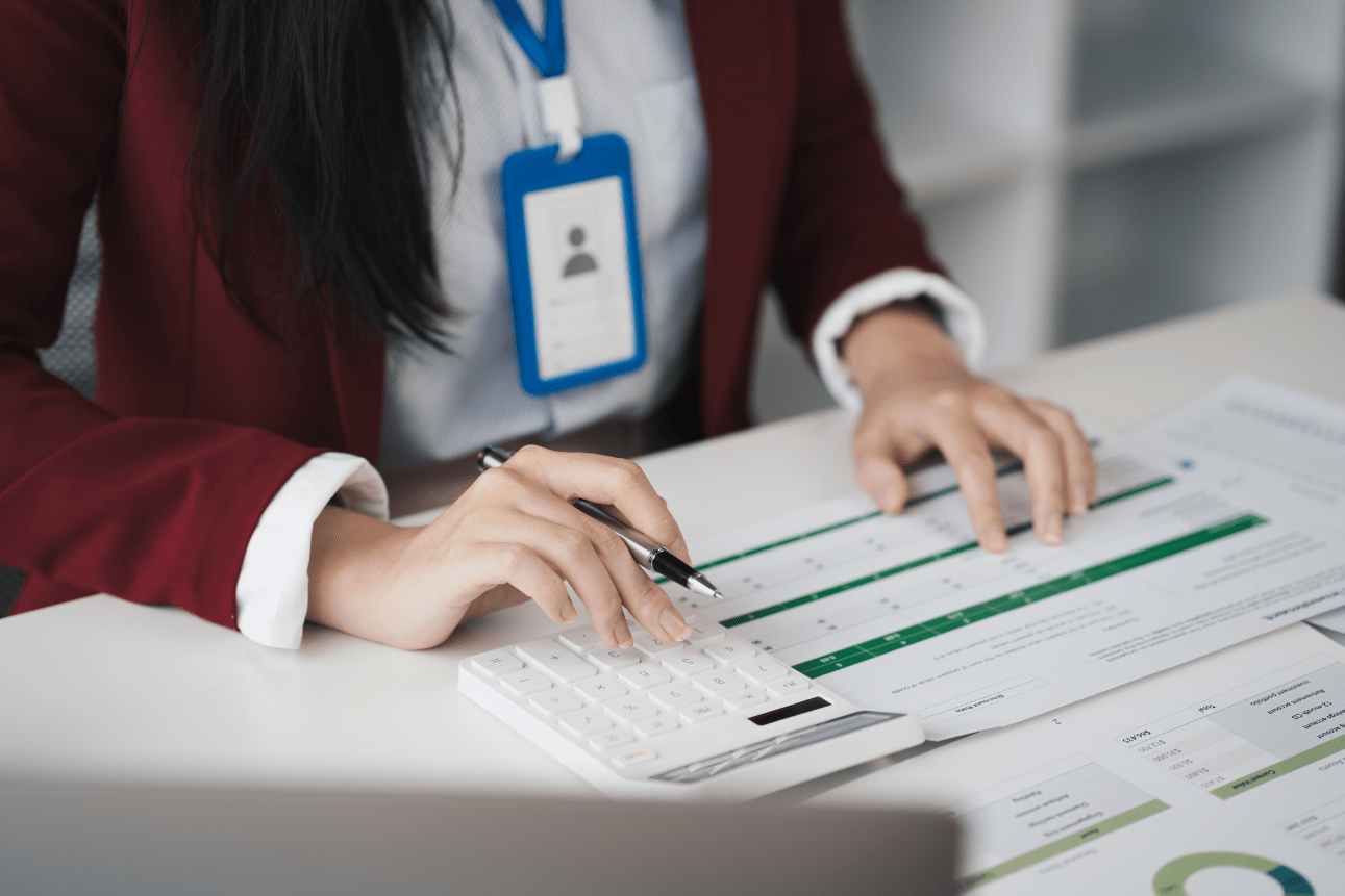 Female accountant using calculator for financial tasks