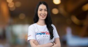 An outsourced bookkeeping executive woman is smiling while crossing her arms.