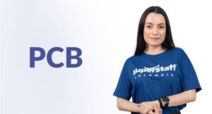 A payroll outsourcing professional man is computing.