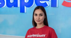 A payroll outsourcing executive woman is crossing her arms.