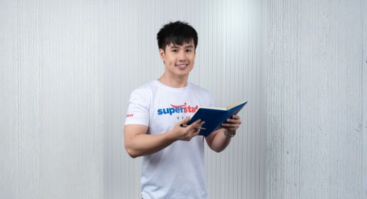 A professional billing specialists crossing his arms with a smile on his face.