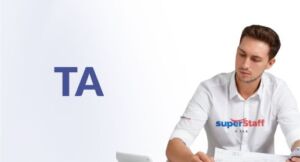 An outsourced accounting services professional is working on papers.