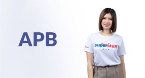 Heading (7) An outsource bookkeeping professional woman is holding a tablet.