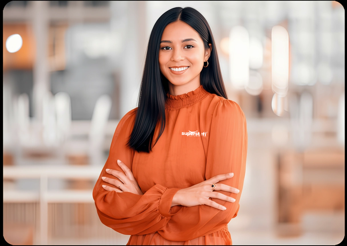 A financial analyst professional is smiling while posing.